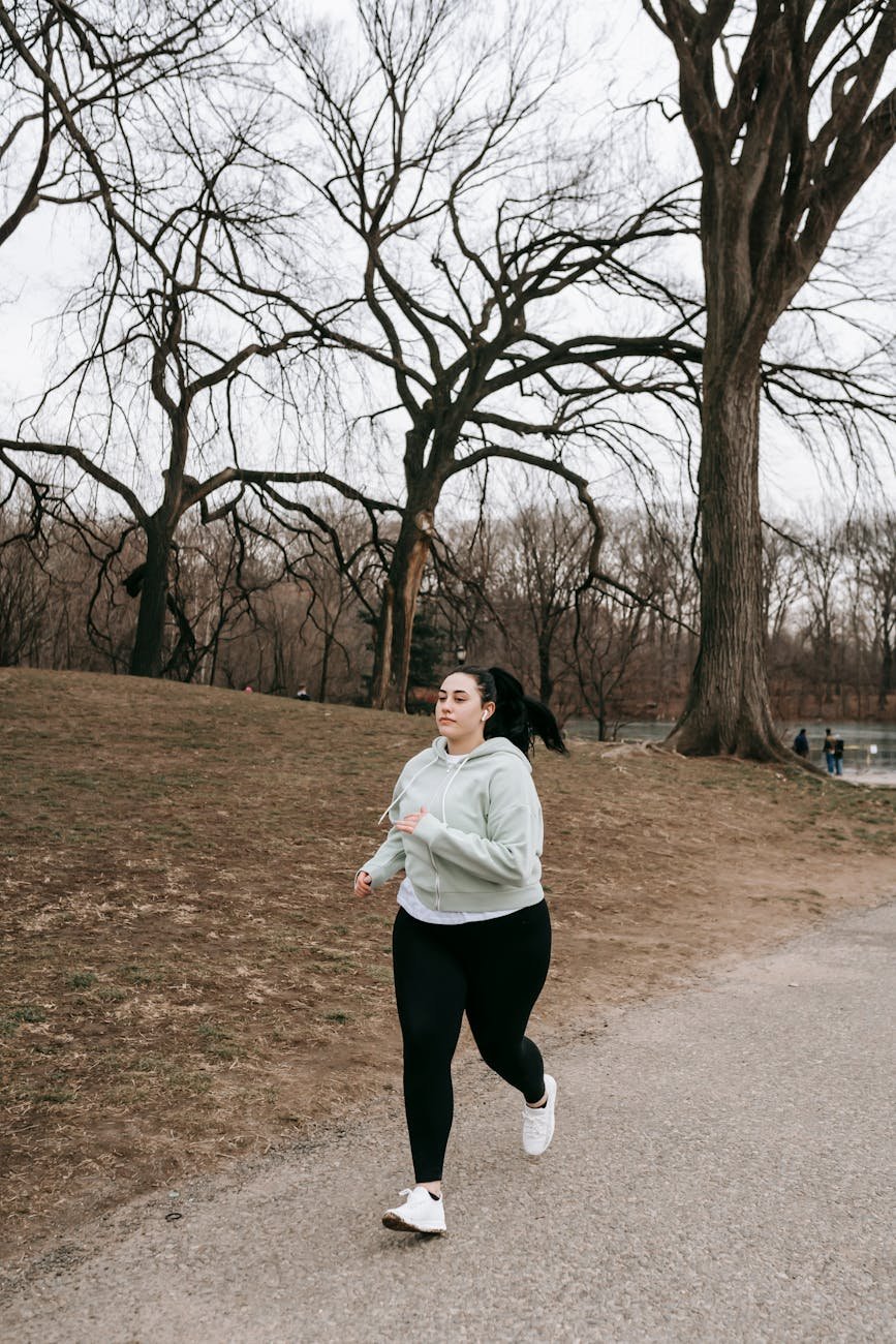 a sportswoman jogging in a park